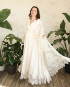 A spirited shot of the flowing lace hem as it twirls, capturing the sense of quiet luxury and effortless grace.