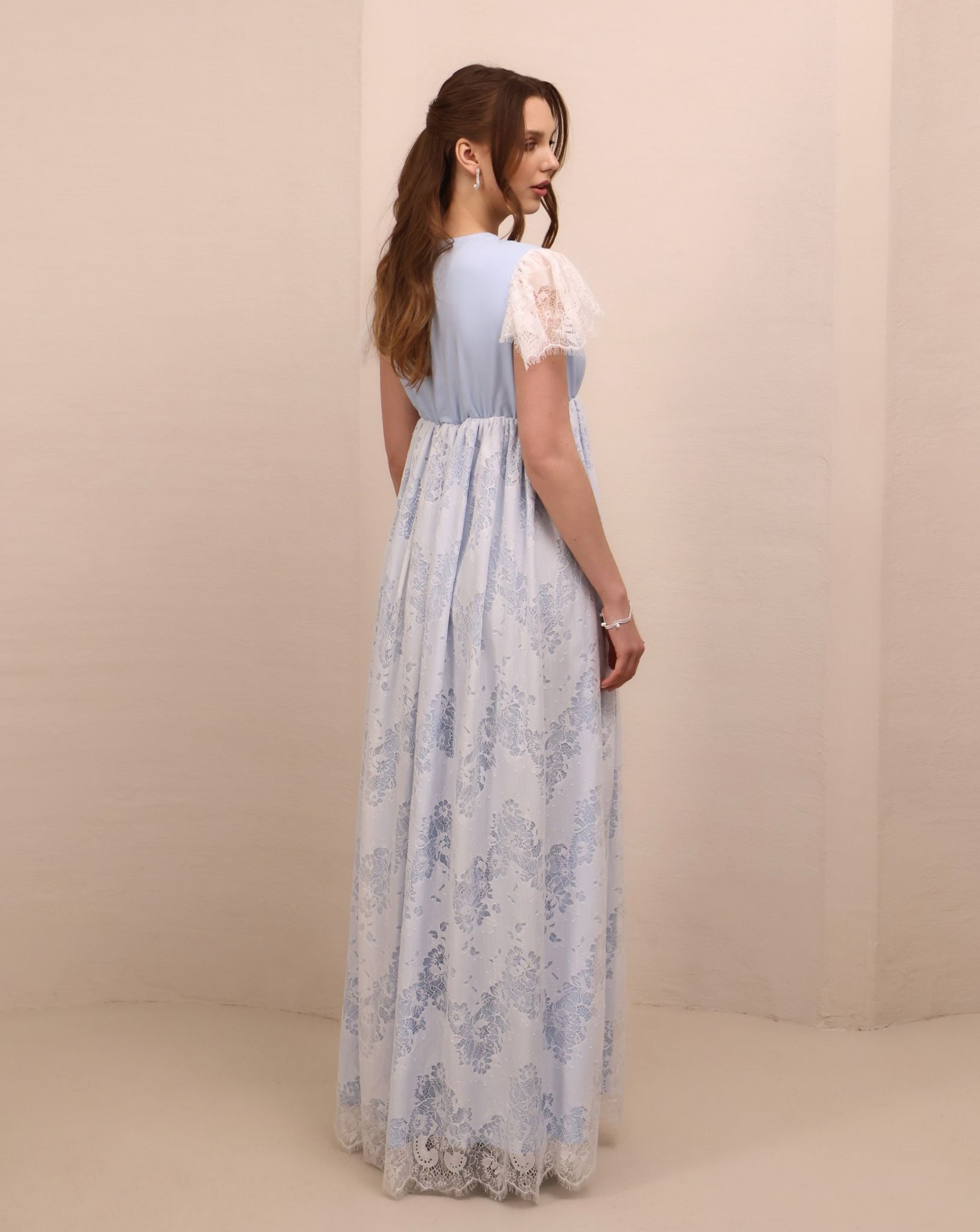 Rear view of the slip dress, illustrating the breathable fit and the graceful drape of the cotton-viscose blend.