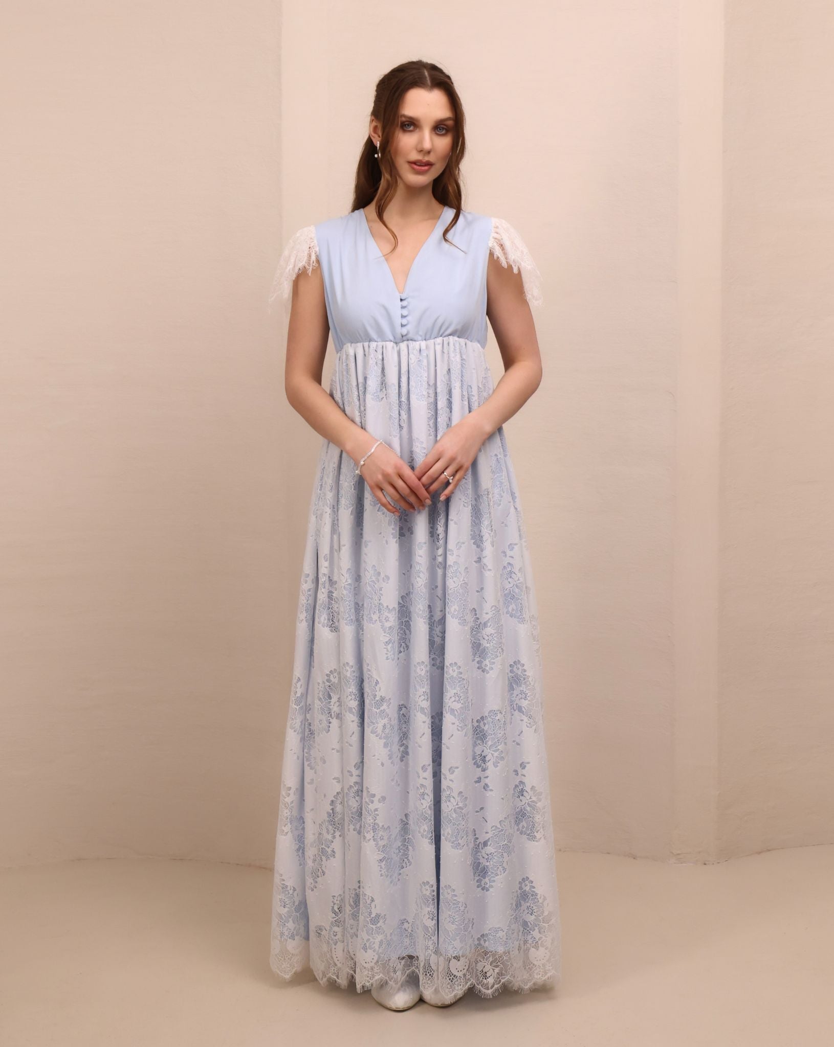 Frontal view of the nightgown featuring lace-trimmed shoulders and buttons for discreet breastfeeding access.