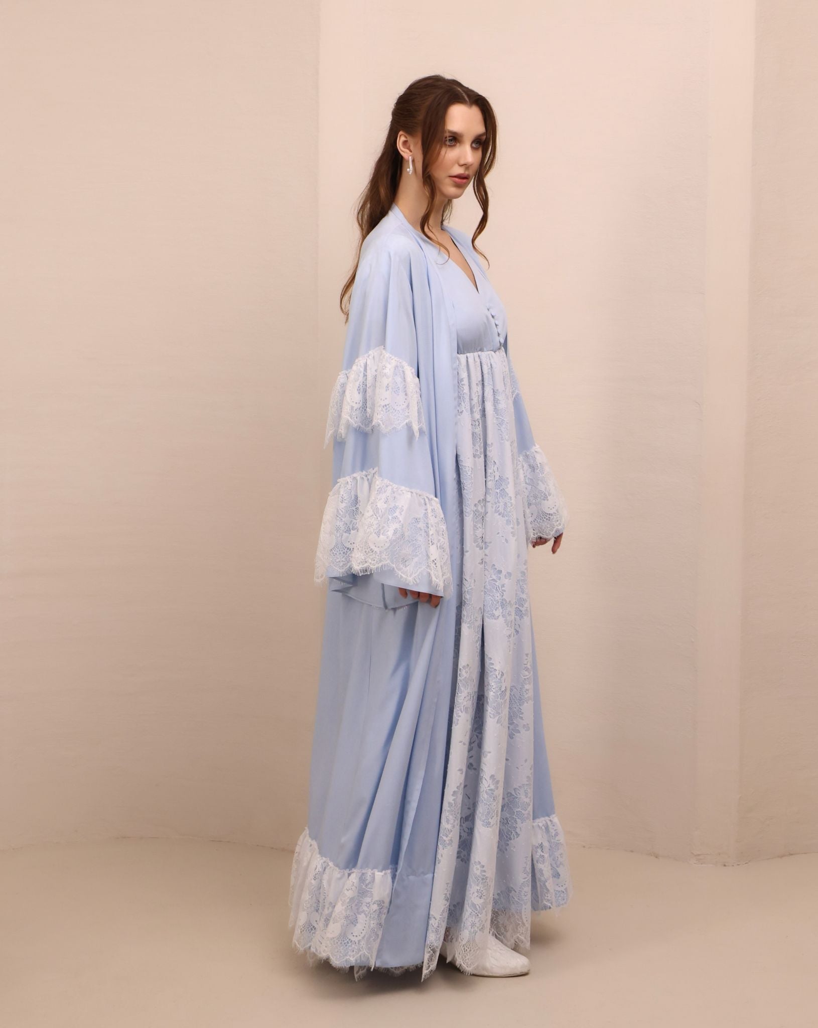 Side perspective of the attire, highlighting the effortless A-line silhouette and the soft, gathered waist.