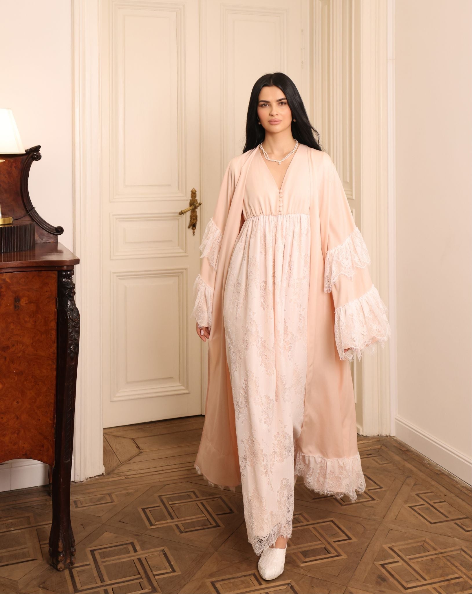 A dynamic view of the Cotton Robe and Nightgown Set in motion, capturing the ethereal finish and graceful movement.