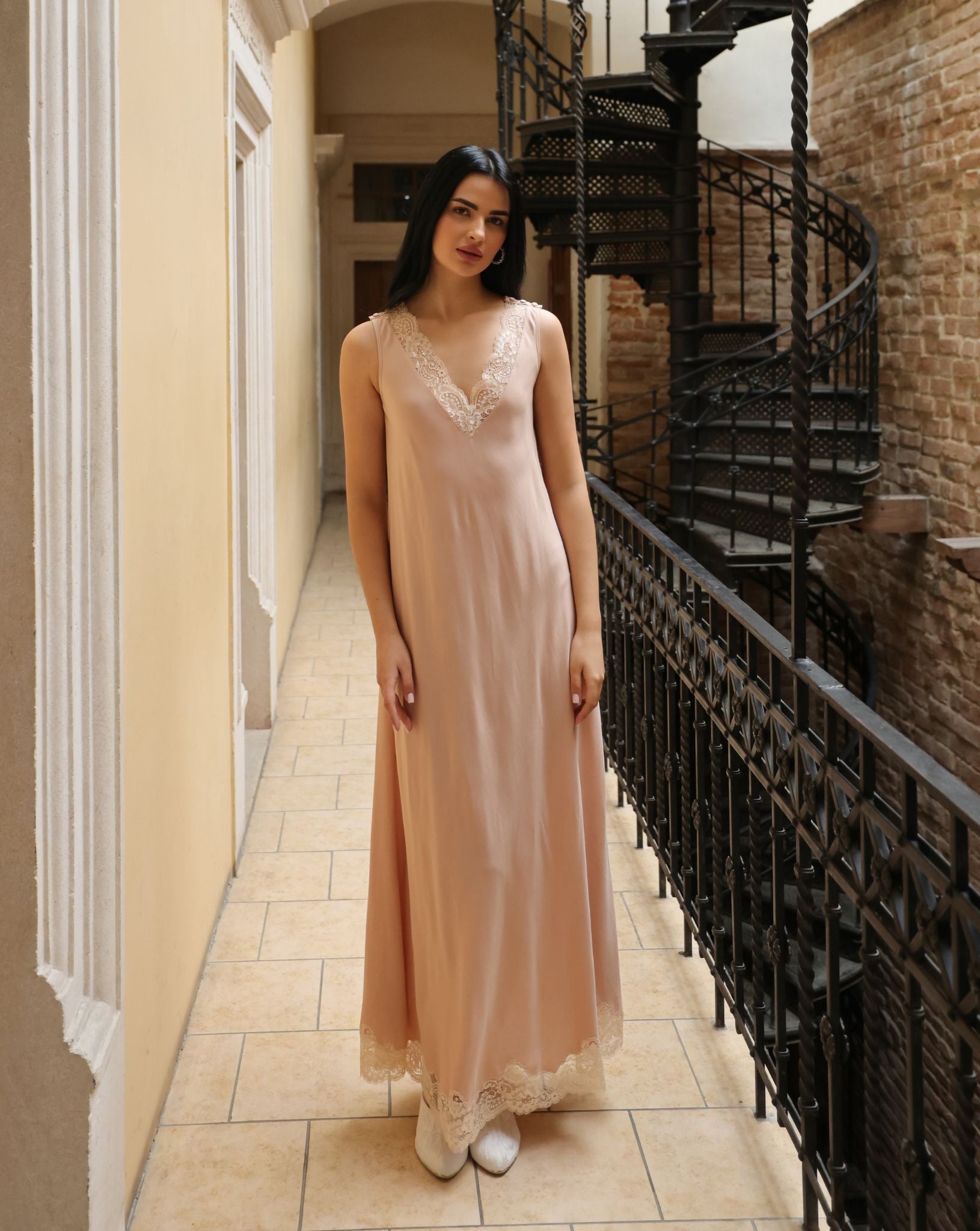 Frontal view of the loose-fitting nightgown, highlighting the elegant lace details and the comfortable, wide silhouette.