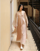 A dynamic motion shot of the Robe and Nightgown Set, capturing the breathability and effortless style of the silk-cotton fabric.