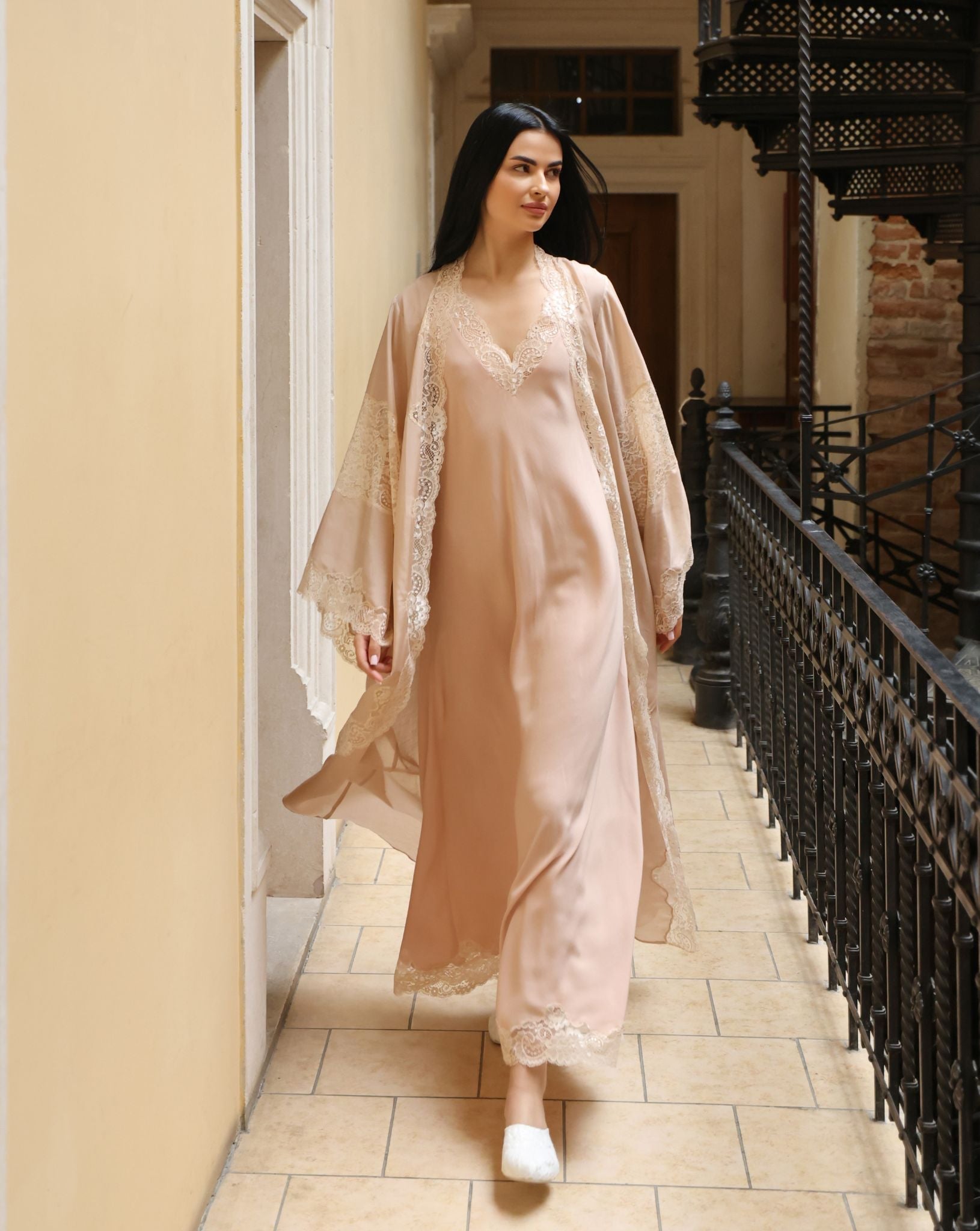 A dynamic motion shot of the Robe and Nightgown Set, capturing the breathability and effortless style of the silk-cotton fabric.