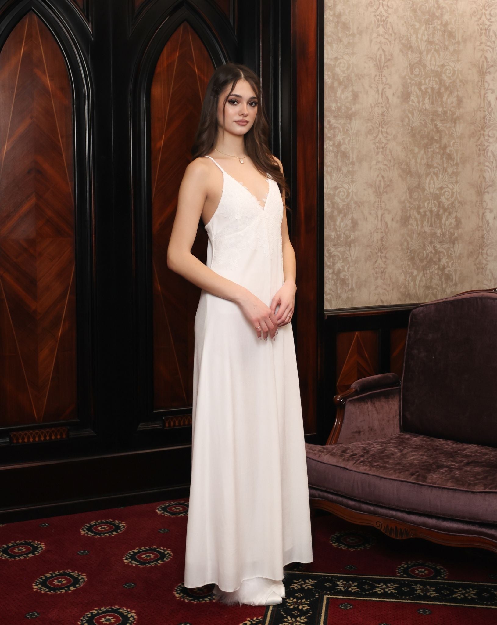 Side view of the nightgown, featuring bias-cut lines and lace adorned V-neck that follows the body with ease.