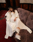 A creative shot of the luxurious lounge set, highlighting the soft drama and plush texture of the pearl velvet.