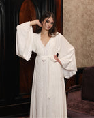 Mid-length view of the kimono style wrap, embellished with cotton lace for a touch of effortless grandeur.