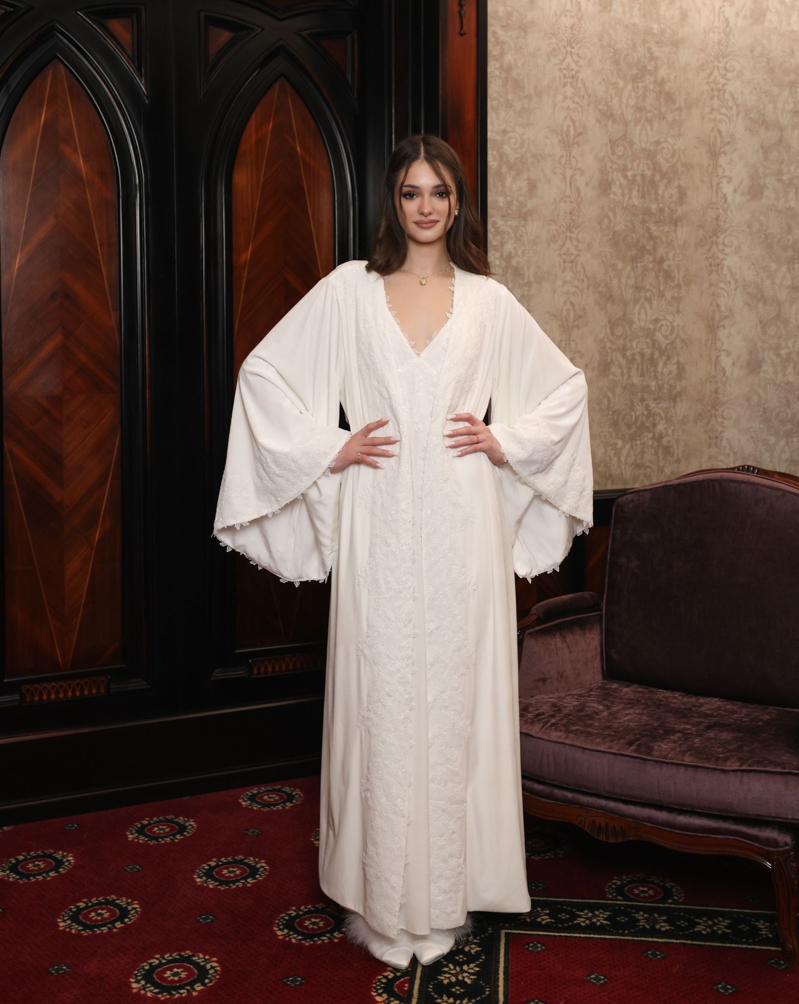 A shot of the complete set with hands on the waist, showcasing the perfect drape and warming weight of the velvet.