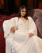 An atmospheric shot showing the velvet ensemble, designed for warmth and sensual moments during cold months.