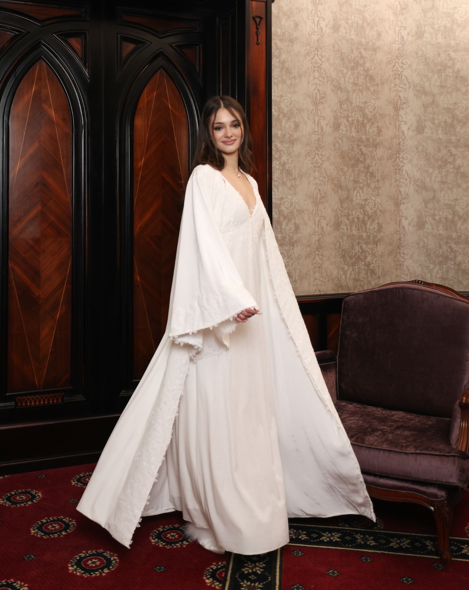 A dynamic shot of the Velvet Robe in motion, illustrating the visual poetry of the flowing silhouette.