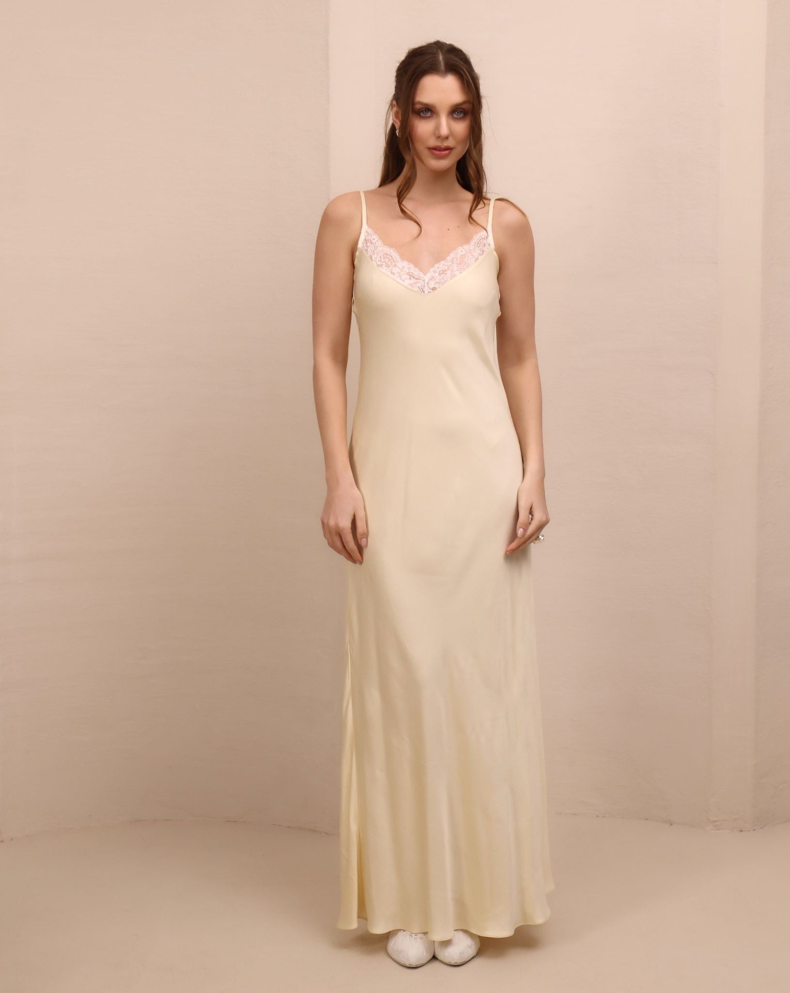 Frontal shot of the delicate nightgown, showcasing the refined texture and movement designed for bridal preparations.