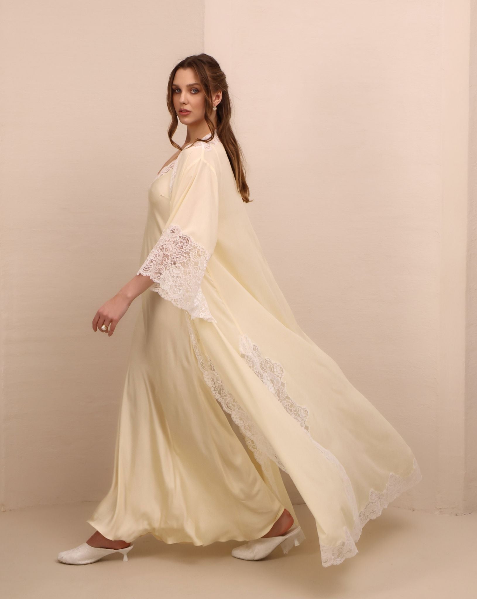 A dynamic side view of the Robe and Nightgown Set in motion, capturing the flowing chiffon and sweeping silhouette.