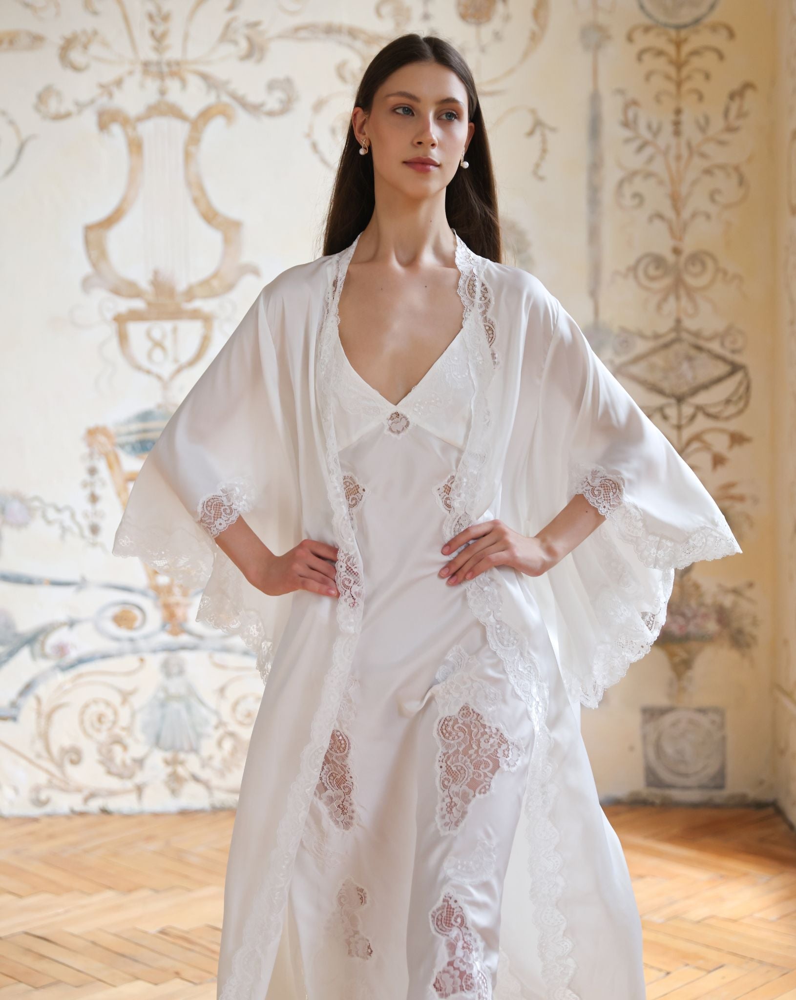 Mid-length static view of the Blossom ensemble, highlighting the elegant wrap-over robe with hands placed on the waist.