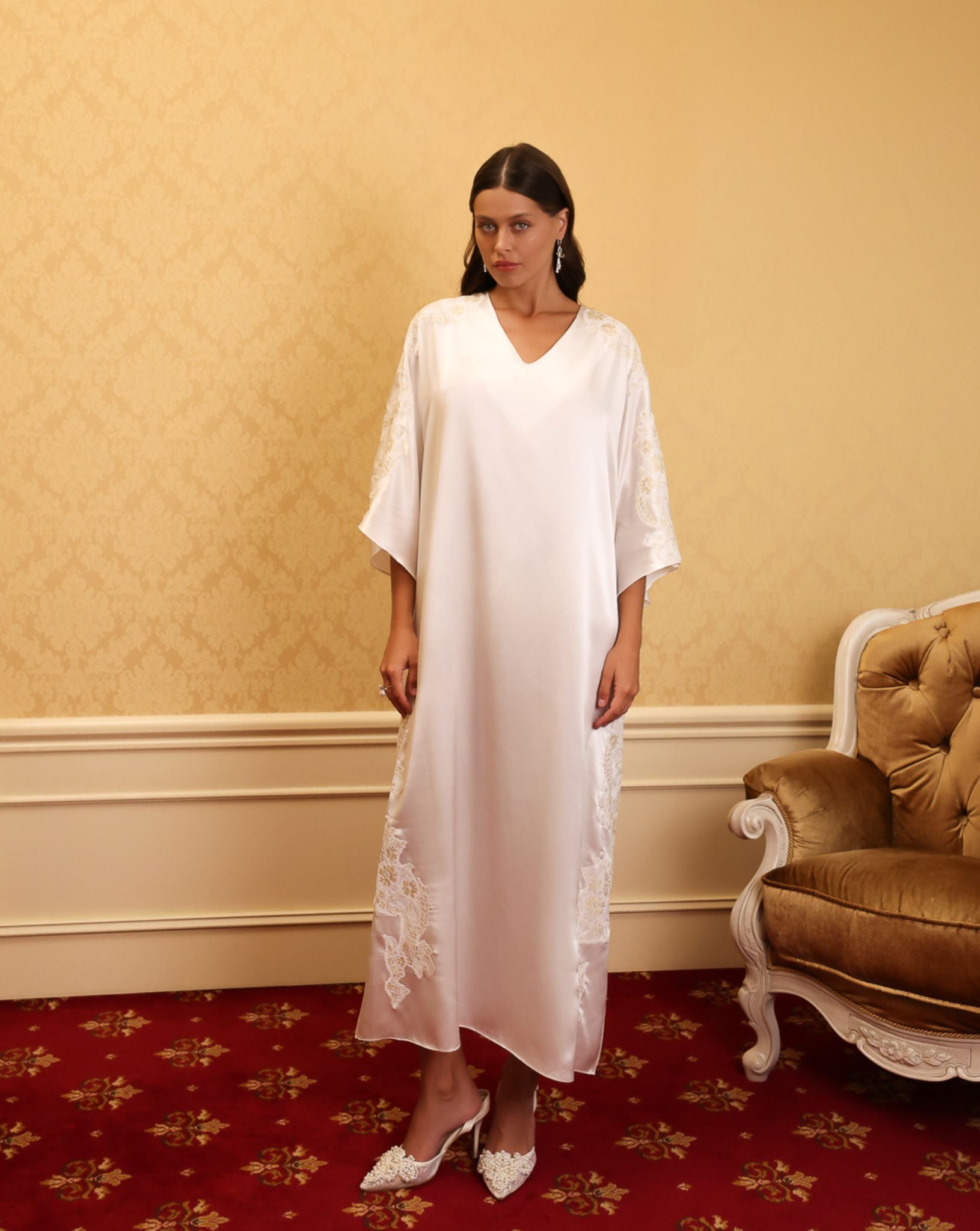 Side view of model in white satin kaftan with gold embroidery – KÂfemme