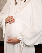 Close-up of the voluminous lace sleeves, showcasing the intricate patterns and the romantic, heirloom feel.