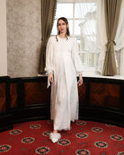 A full-length shot of the Modest Lounge Dress in motion, illustrating the grace of the layered lace skirt.