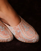 Close-up top view of the Satin Slippers, focusing on the intricate lace patterns and the satin base.
