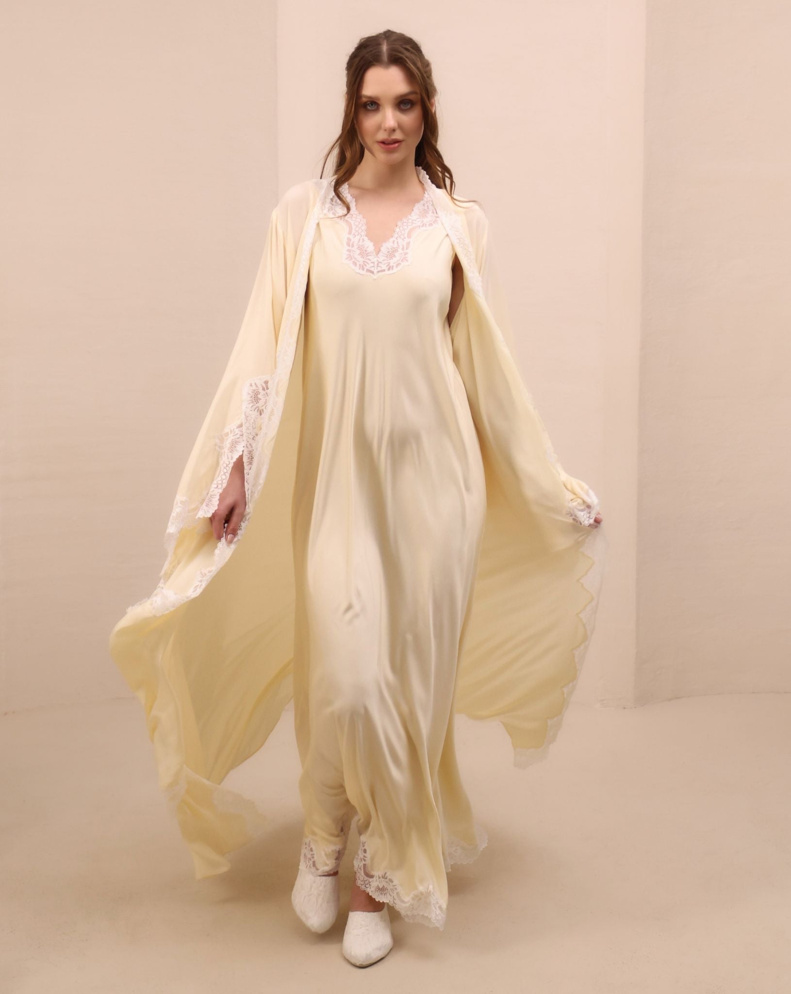 A spirited shot of the Robe and Nightgown Set in motion, highlighting the harmony between sheer textures and lace.