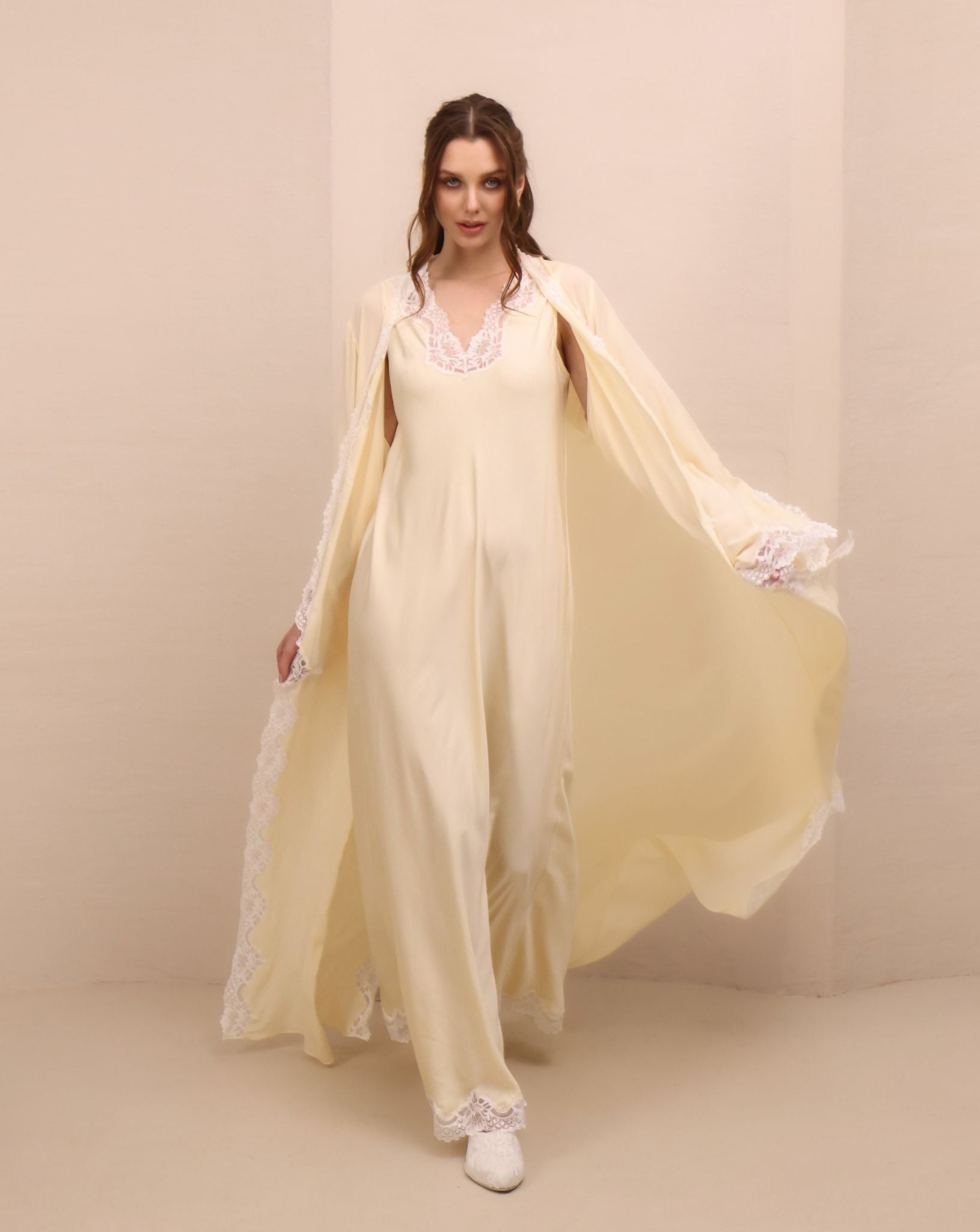 A dynamic motion shot of the Robe and Nightgown Set, capturing the fluid rayon and elegant side slits.