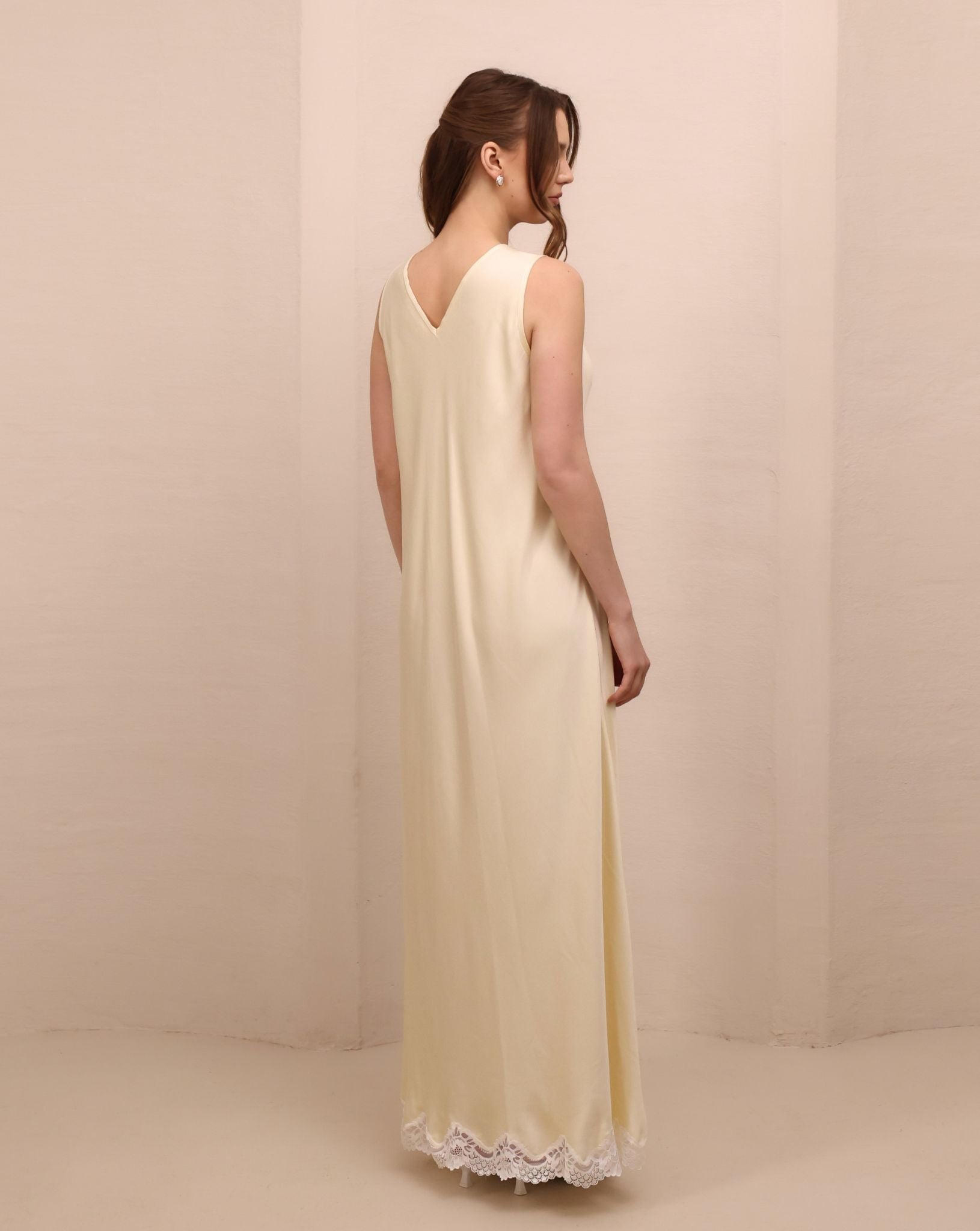 Rear view of the nightdress featuring a short open V-cut back for a touch of timeless sophistication and allure.