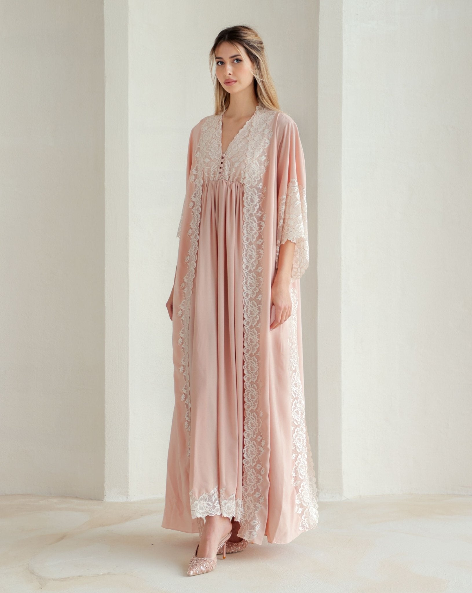 Walking in a long, graceful ensemble that allows for movement without restriction during and after pregnancy.