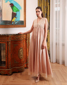 Side view of the cotton nightgown, illustrating the loose fit that allows for movement without any restriction.