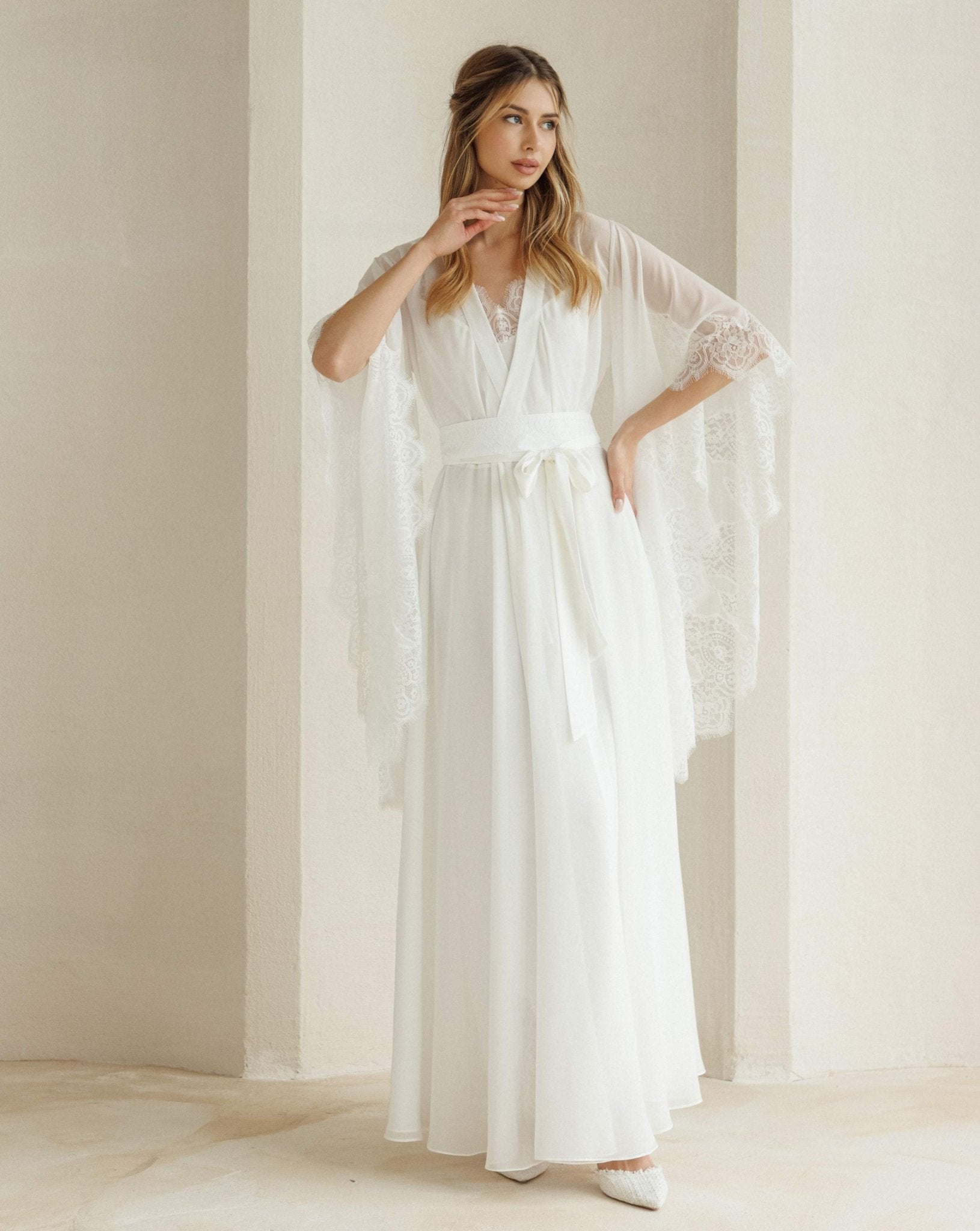 Full-length view of the bridal set tied at the waist with a sash, highlighting the wide sleeves and regal look.