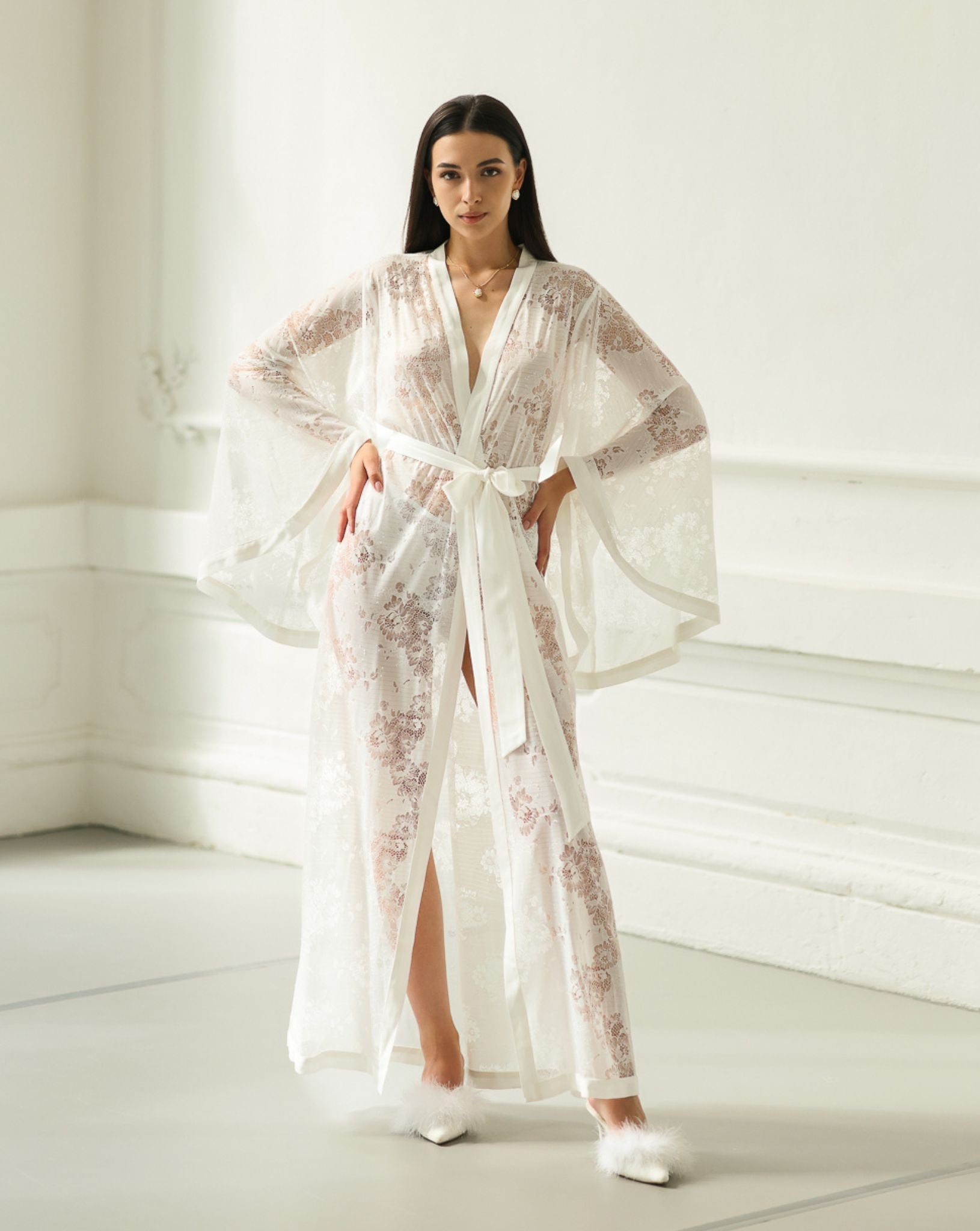 Full-length front view with both hands on the waist, showcasing the sophisticated style and feminine lines of the robe.