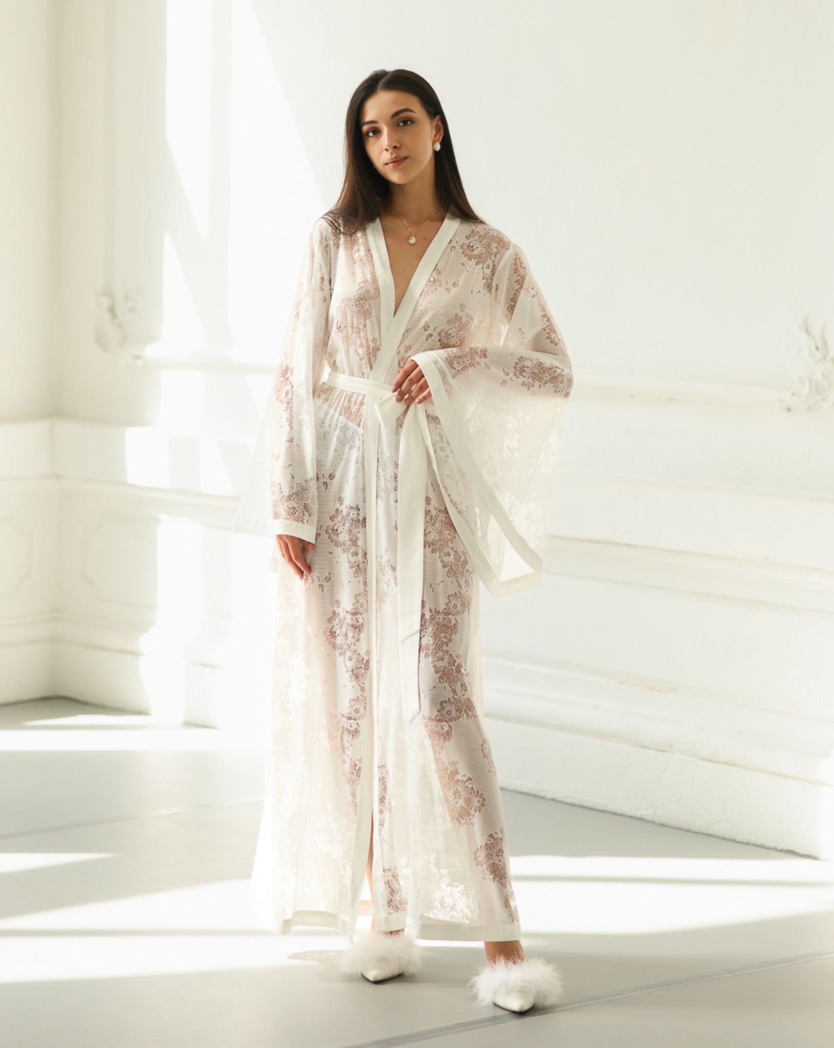 White Kimono Robe in soft lace with cotton detailing, shown in a full-length view with one hand on the waist.