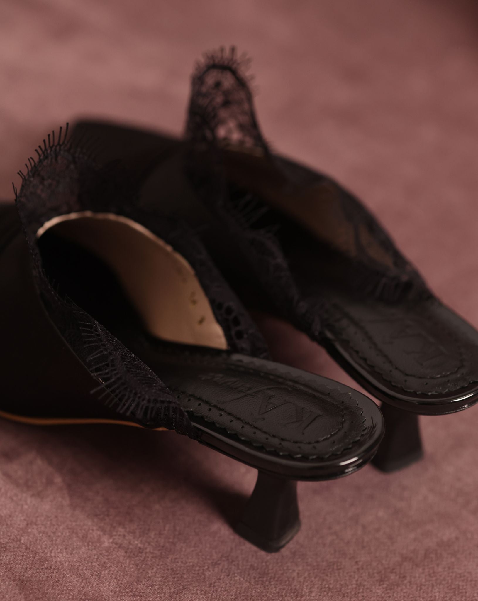 Top view of the Satin Slippers featuring the brand logo on the soft padded genuine leather insole.