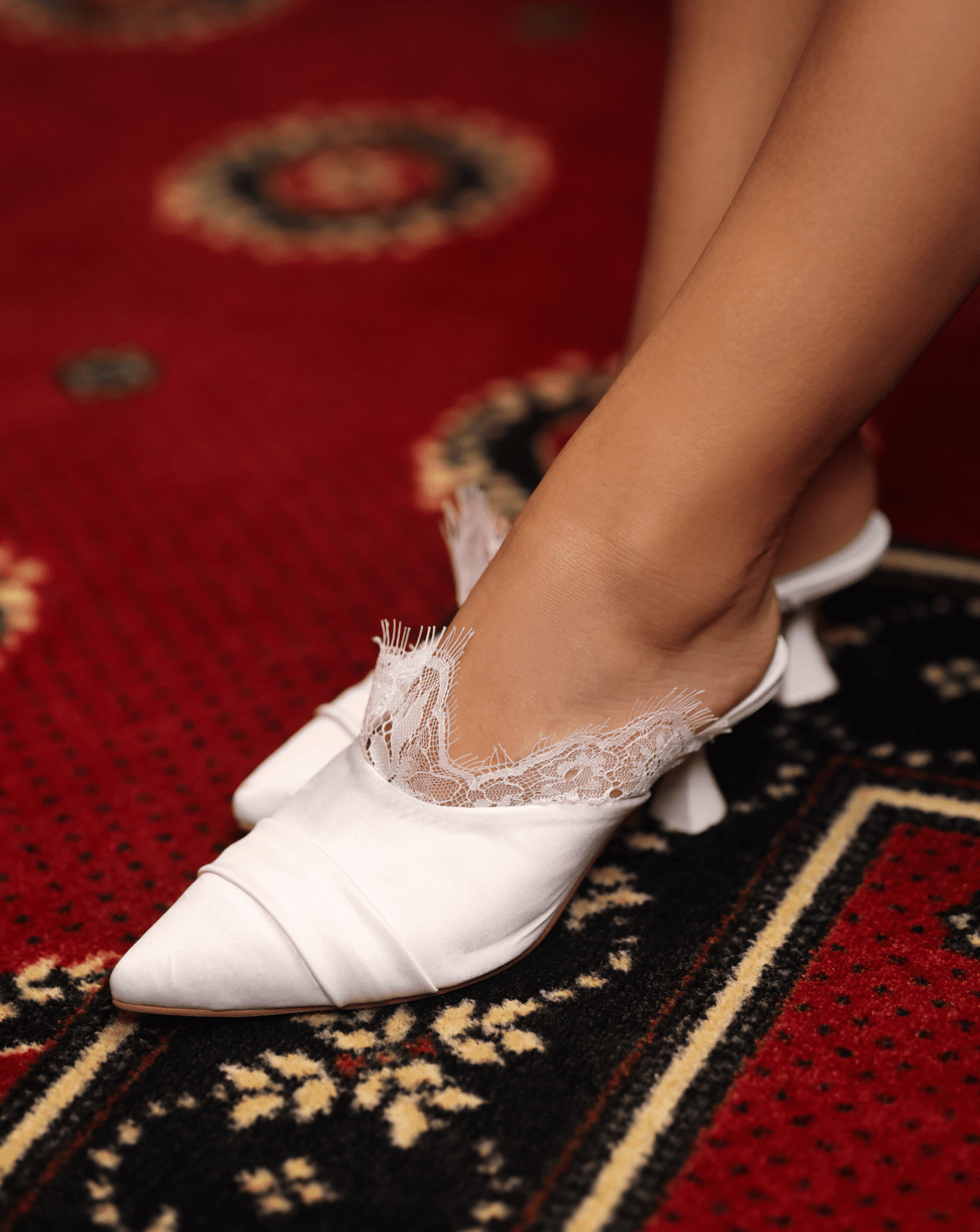 Detailed top view of the Heeled Satin Slippers, focusing on the spacious pointed toe and the luxurious texture.