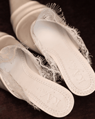 A clear view of the genuine leather insole featuring the brand logo and soft padding for long-wearing comfort.