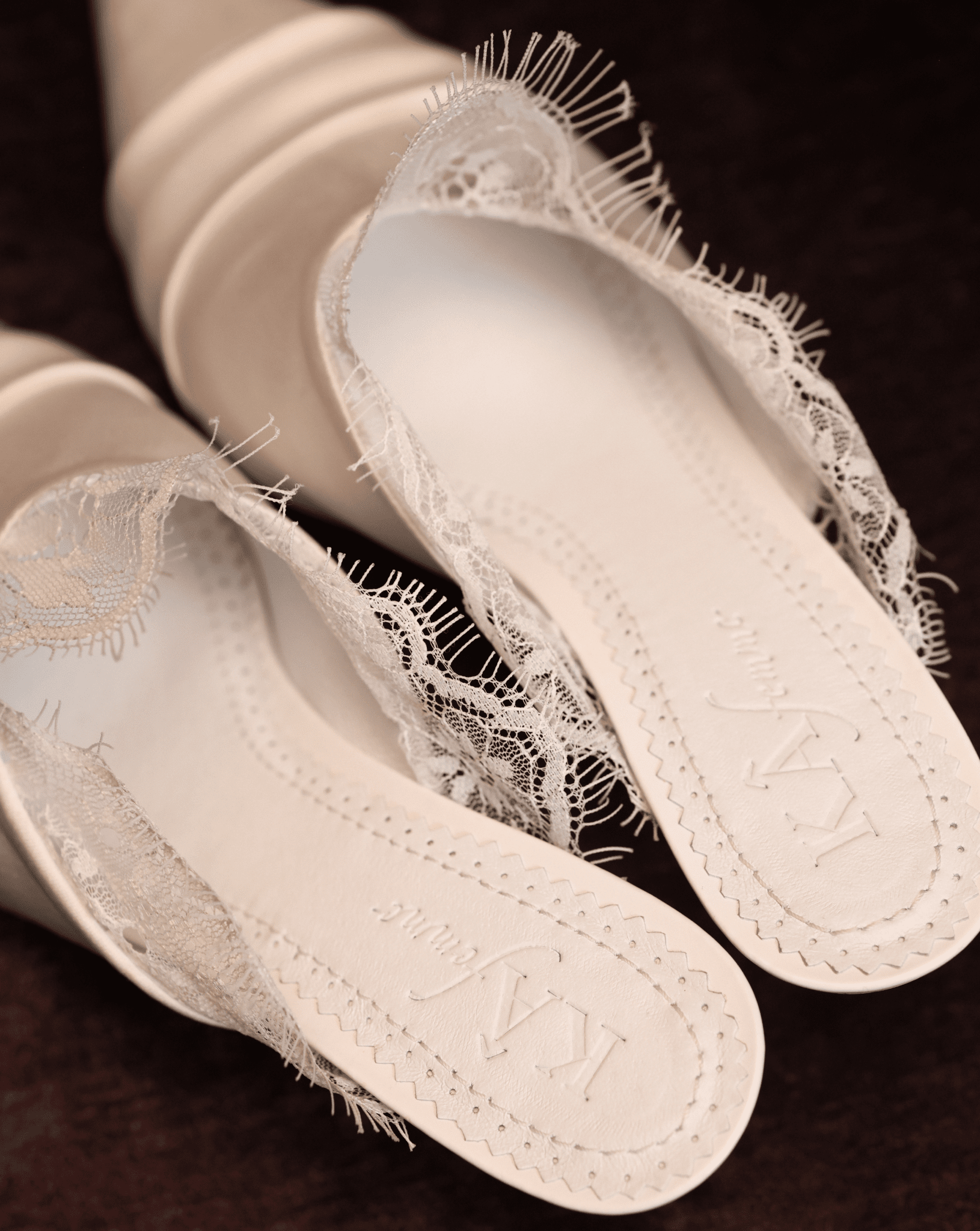 A clear view of the genuine leather insole featuring the brand logo and soft padding for long-wearing comfort.