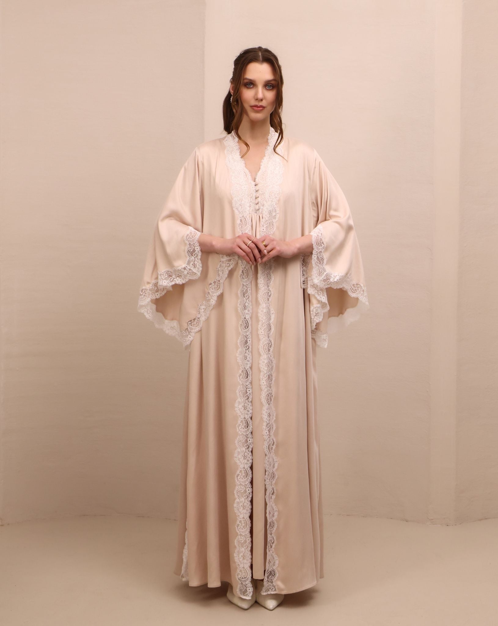 A poised frontal view of the ensemble, designed to offer comfort and serene beauty for expectant mothers.