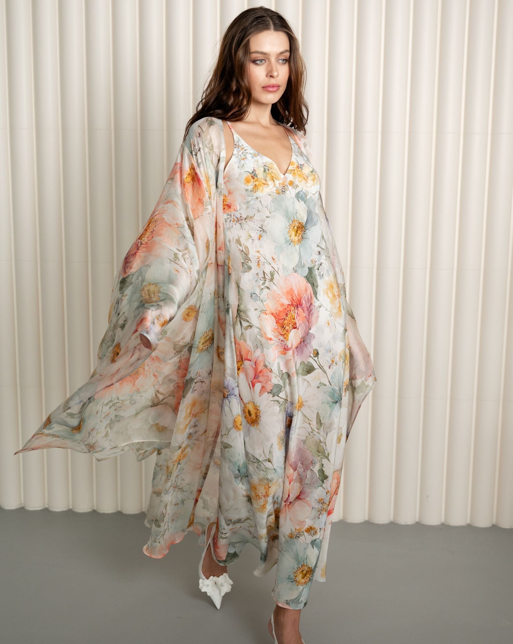 Silk floral robe flowing over pastel nightgown ensemble