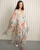 Silk floral robe flowing over pastel nightgown ensemble