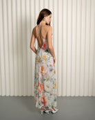 Back view of silk floral nightgown with open criss-cross straps