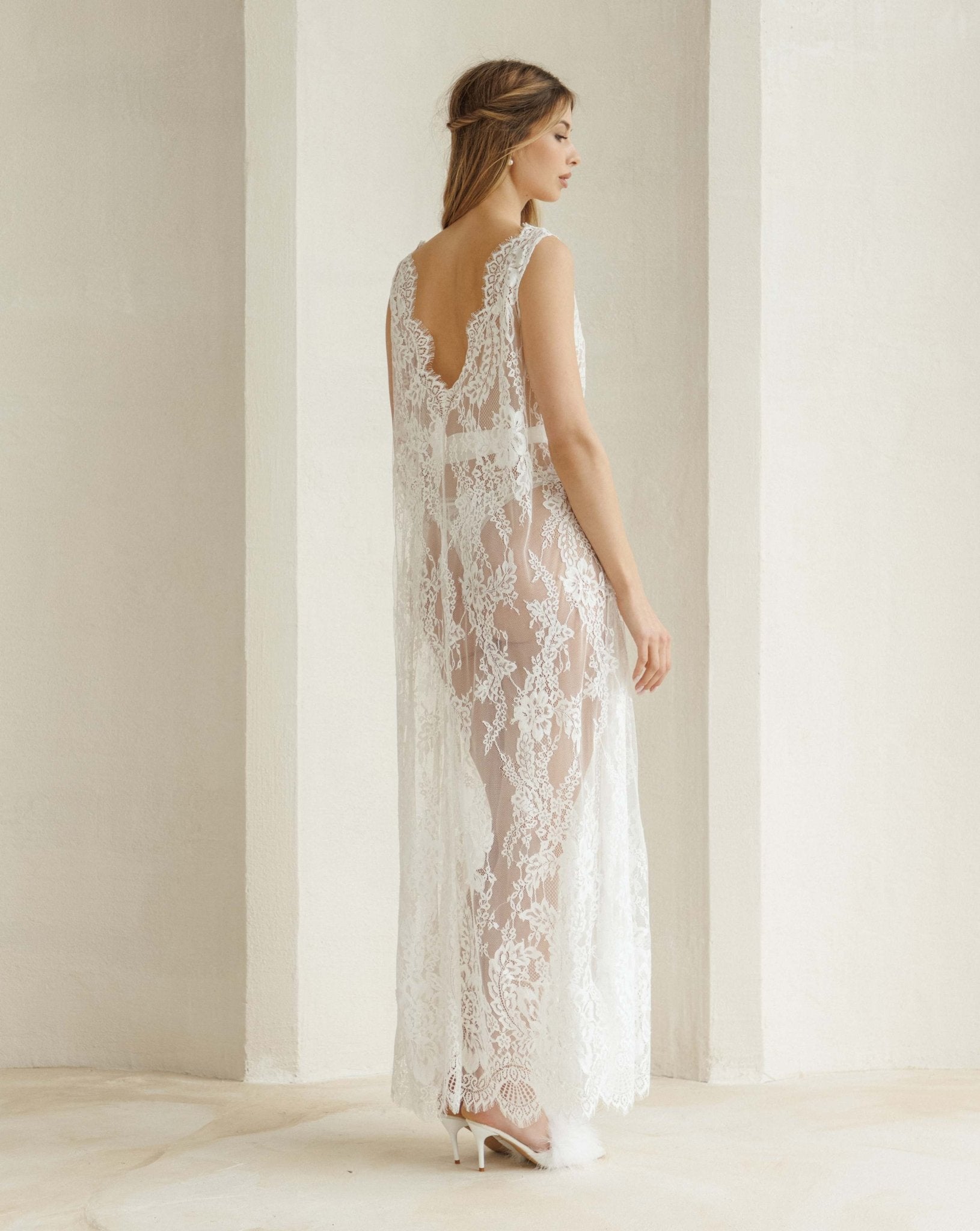 Rear view of the nightdress showcasing the open V-cut back and the intricate beauty of the lace fabric.