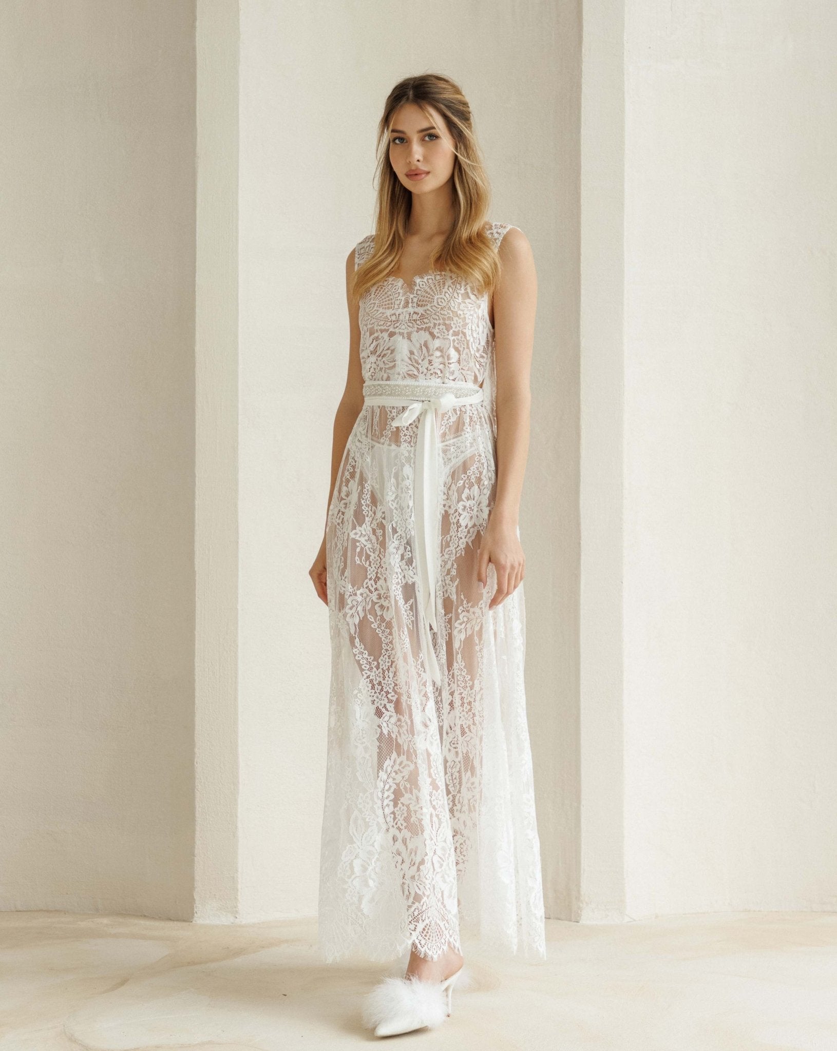 Front view of the delicate nightgown featuring a soft tie at the waist to highlight the figure gracefully.