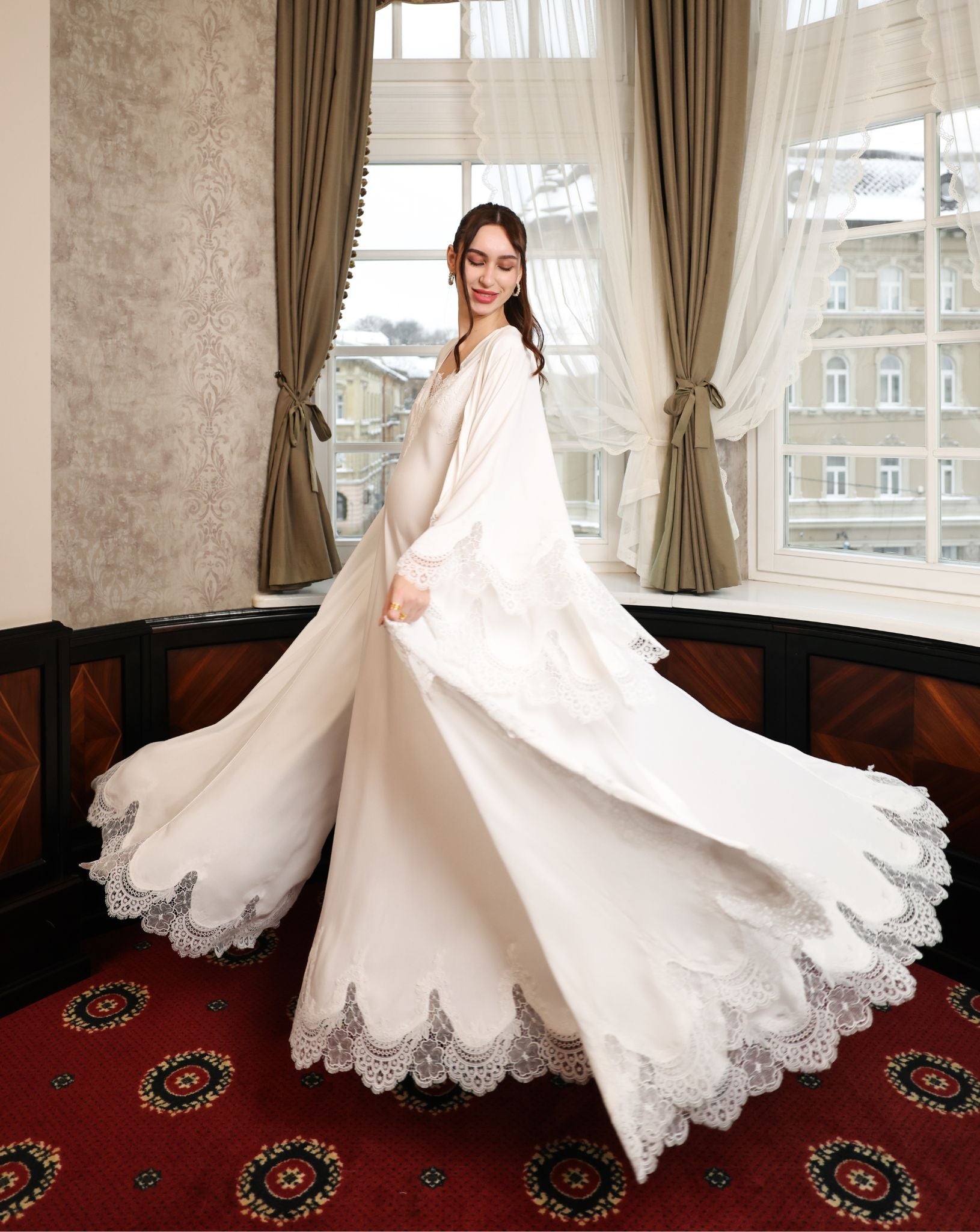 A dynamic action shot showcasing the sweeping movement of the lace-trimmed hem during a graceful turn.