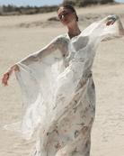A dynamic view of the attire, highlighting the artistic floral design and the graceful movement of the pure silk fabrics.