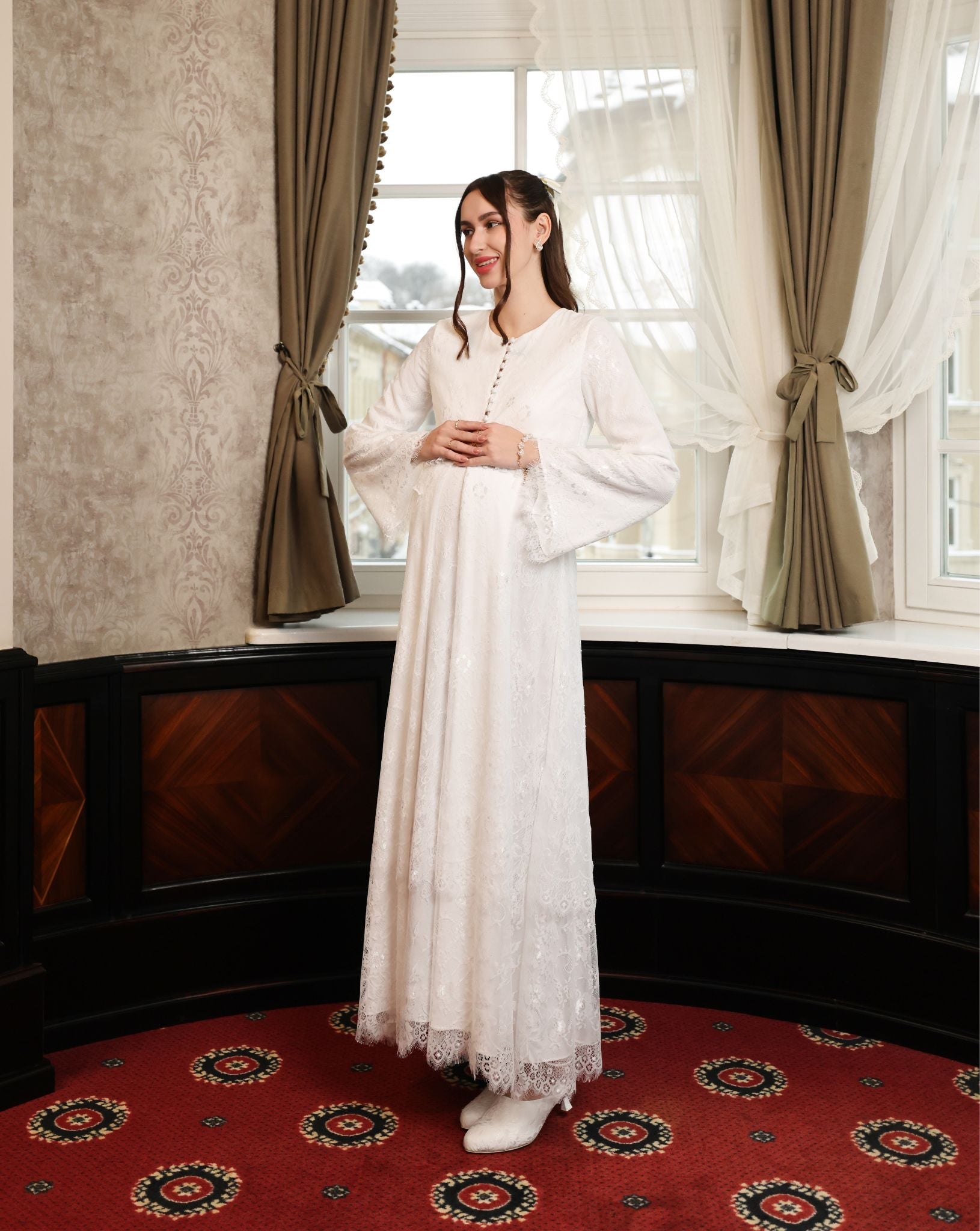 A dynamic side view of the Modest Lounge Dress, highlighting the flattering maternity fit and soft lace movement.