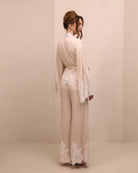 Rear view of the kimono-style ensemble, highlighting the long, clean lines and the smooth fall of the wide-leg pants.