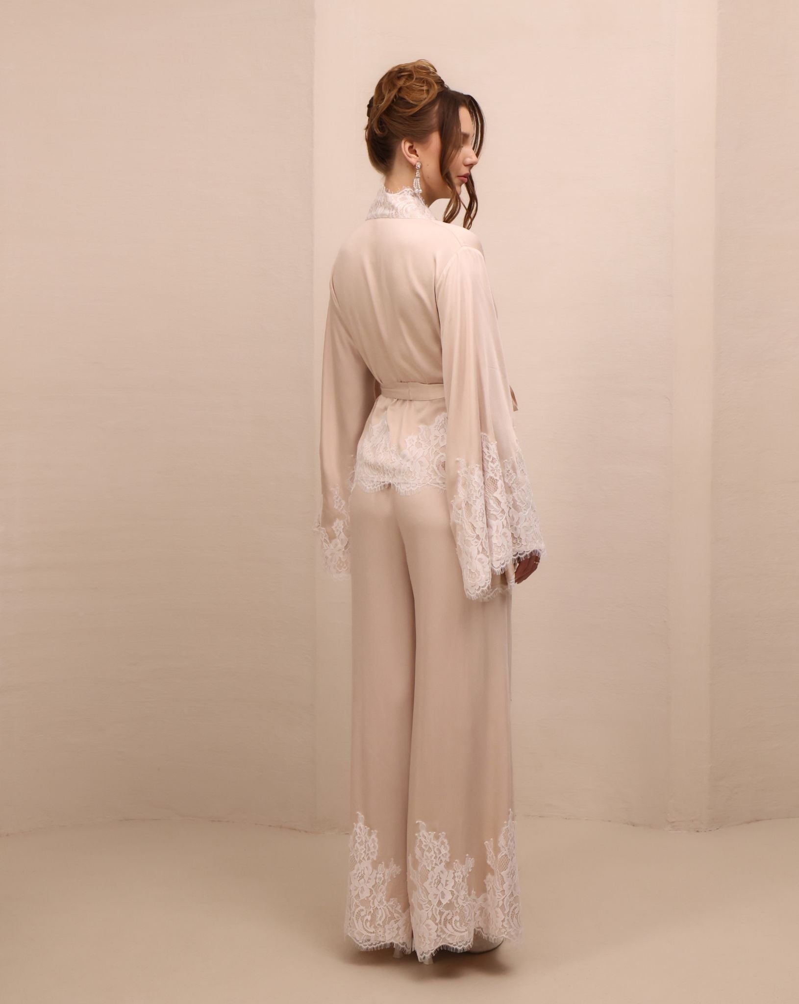 Rear view of the kimono-style ensemble, highlighting the long, clean lines and the smooth fall of the wide-leg pants.