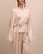 A mid-length shot of the Pyjamas Set, emphasizing the intricate lace-embellished wrap top and the elastic waistband.