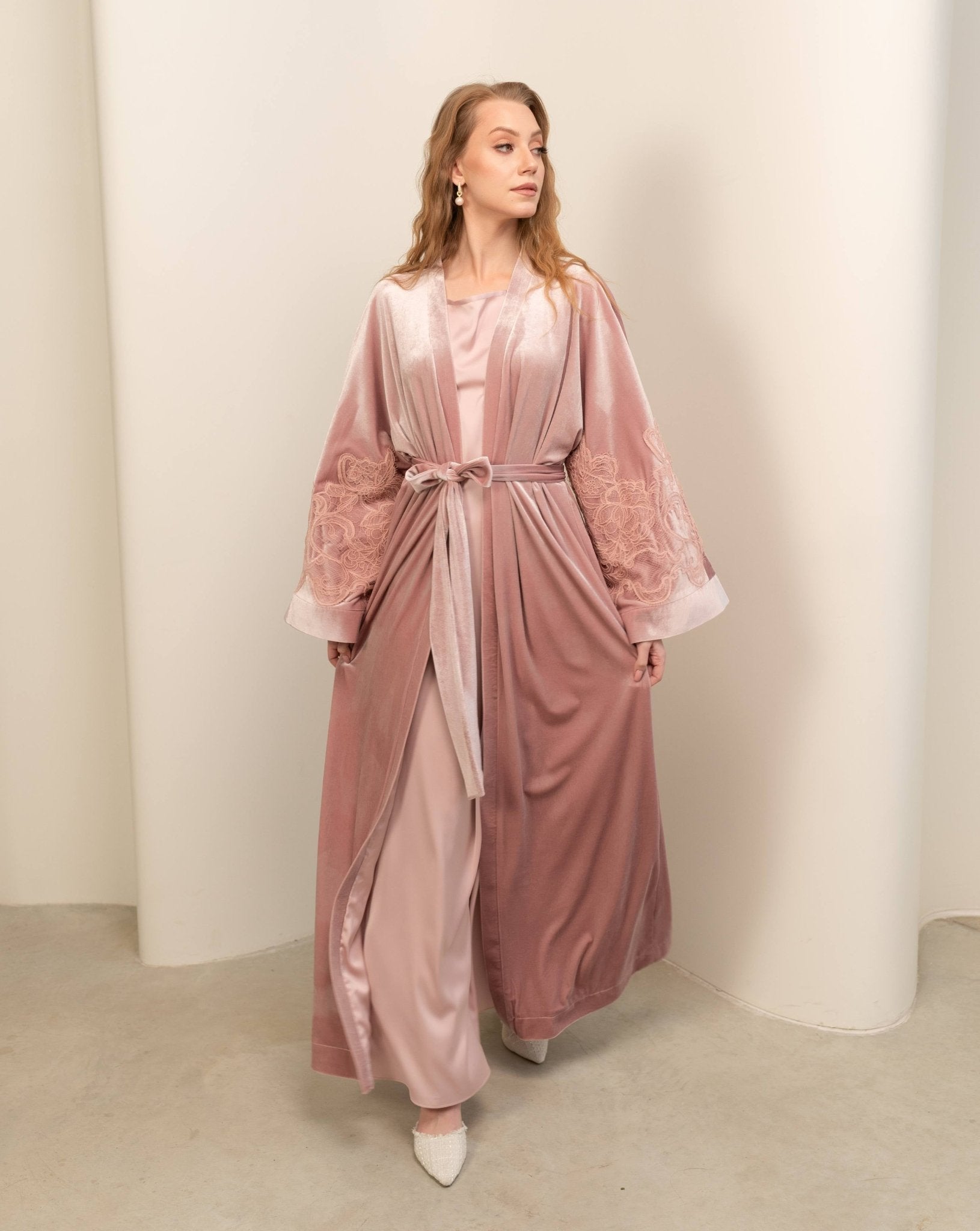 Walking in a tied Abaya set, showcasing the calm softness of velvet and the loose fit for free movement.