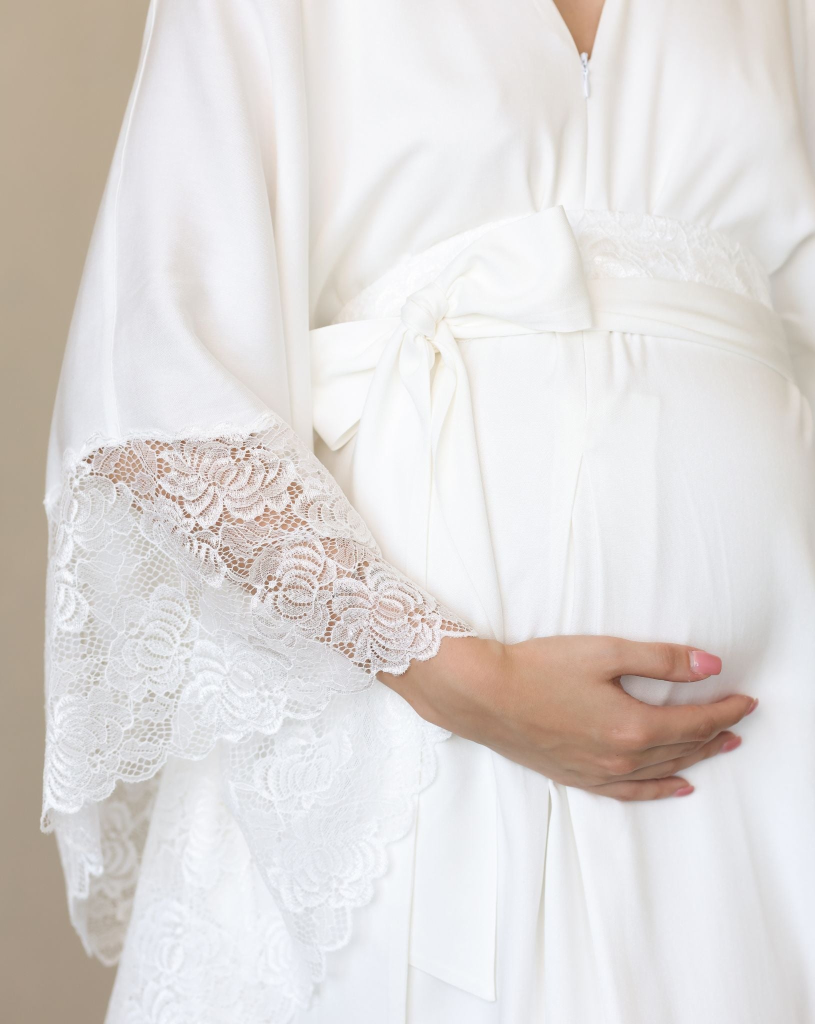 Bridal robe featuring dramatic lace wings and a satin tie for graceful flair.