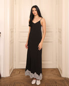 Frontal shot of the nightdress, featuring a gentle neckline and fine straps with regulators for an intentional fit.