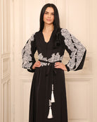 Mid-length view of the ensemble, highlighting the slim tie belt finished with soft tassels for an elegant touch.