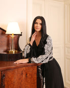 An atmospheric shot of the Robe and Nightgown Set, capturing the effortless elegance designed for quiet evenings.